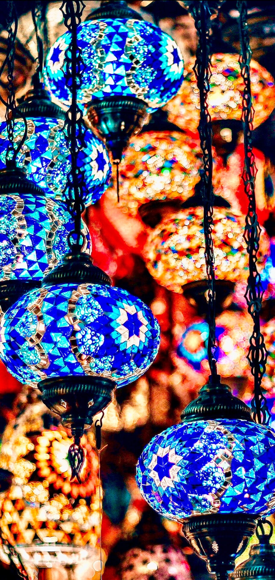 A vibrant corridor inside the Grand Bazaar with colorful shops