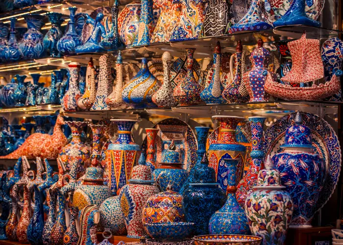 Hand-painted ceramics stacked on the shelves of a Grand Bazaar shop