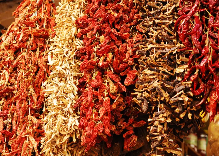 Strings of dried peppers and spices hanging at a Spice Bazaar stall