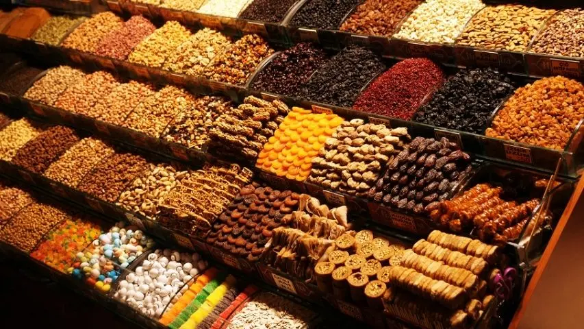 Trays of Turkish delight and dried fruit lined up inside the Spice Bazaar