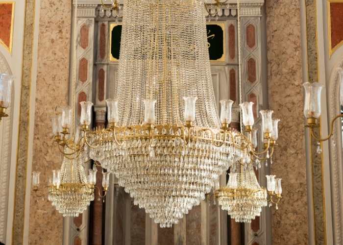 The crystal chandelier hanging before Ortaköy Mosque's marble mihrab